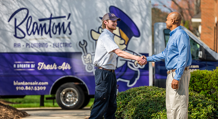 Blanton's service professional shaking the hand of a homeowner