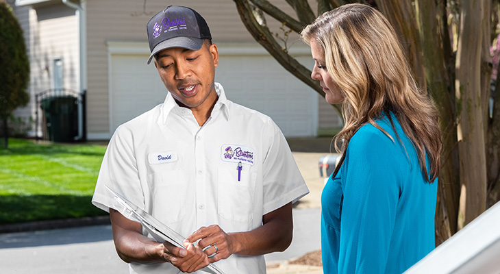 Blanton's service professional speaking with a homeowner