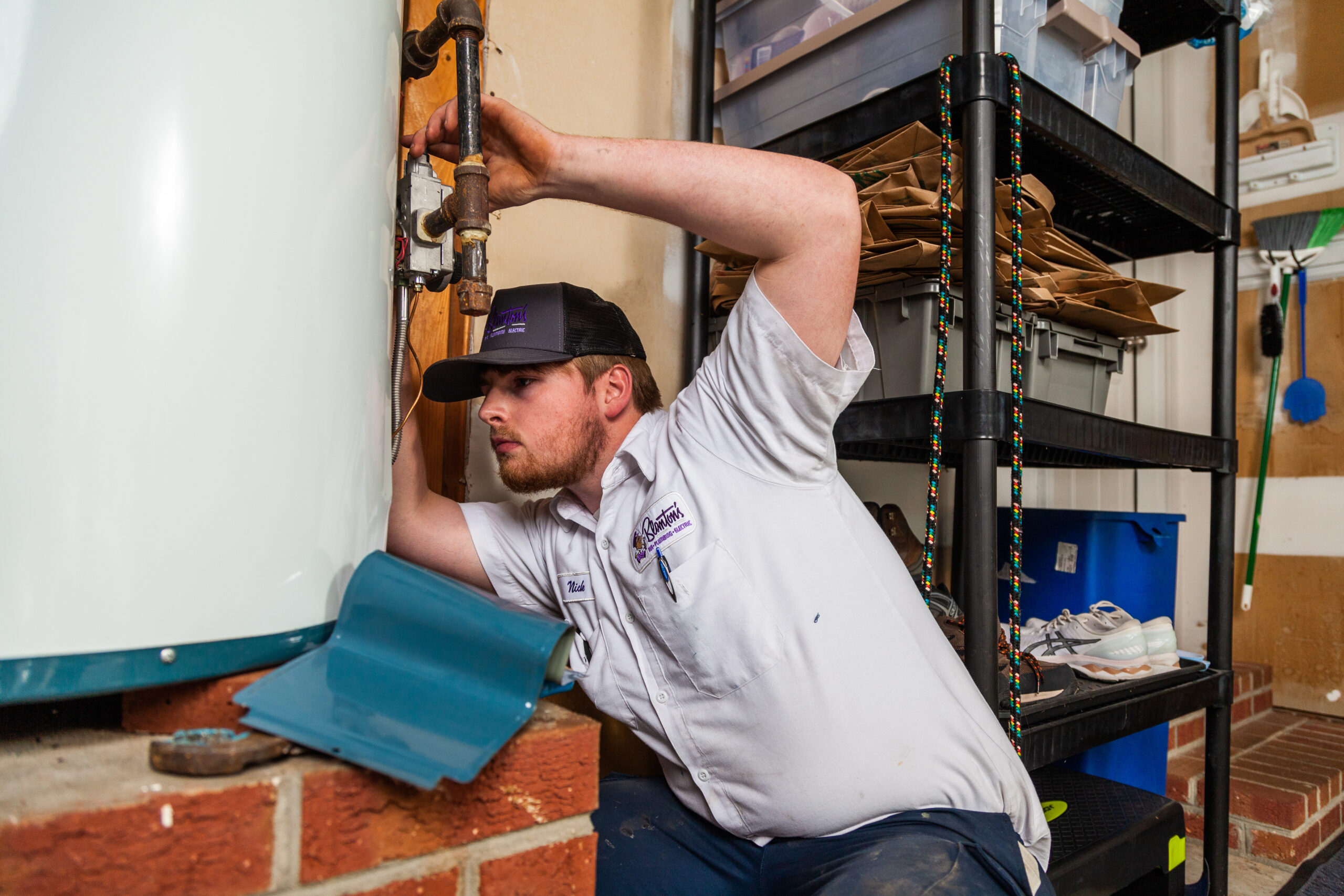 Blanton's technician fixing a water heater